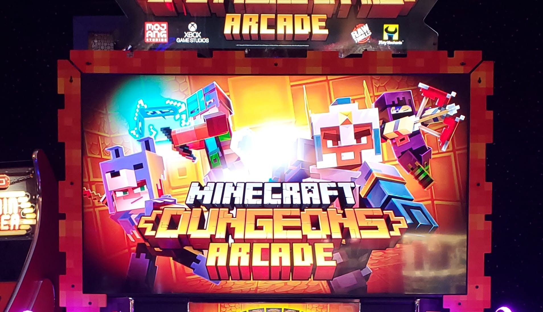 Minecraft Dungeons Arcade poster in bright neon colors with game characters and arcade cabinet style framing