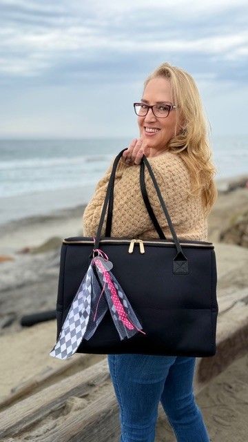 The Birdie insulated tote bag by The Stever Co at Del Mar waterfront sunset