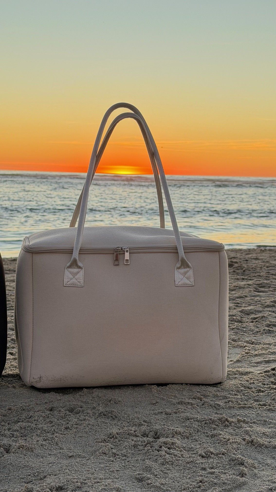 Salt & Stone insulated tote bag by The Stever Co on Del Mar beach at sunset
