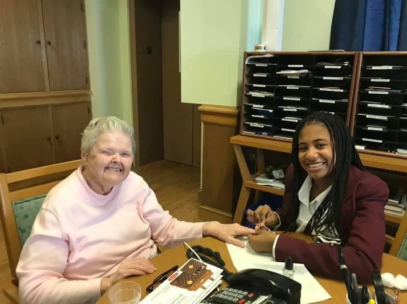 SHA student helping
