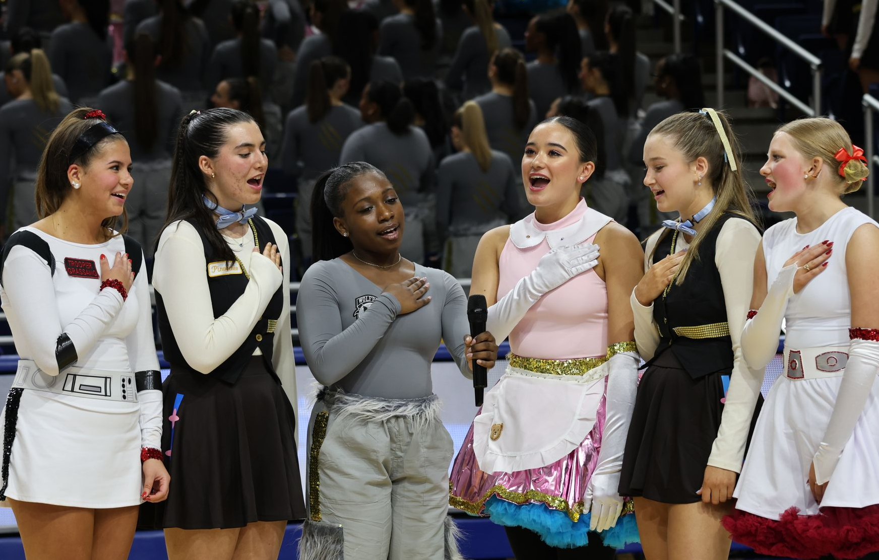 Six Sacred Heart Academy students signing the National Anthem at Red & Gold