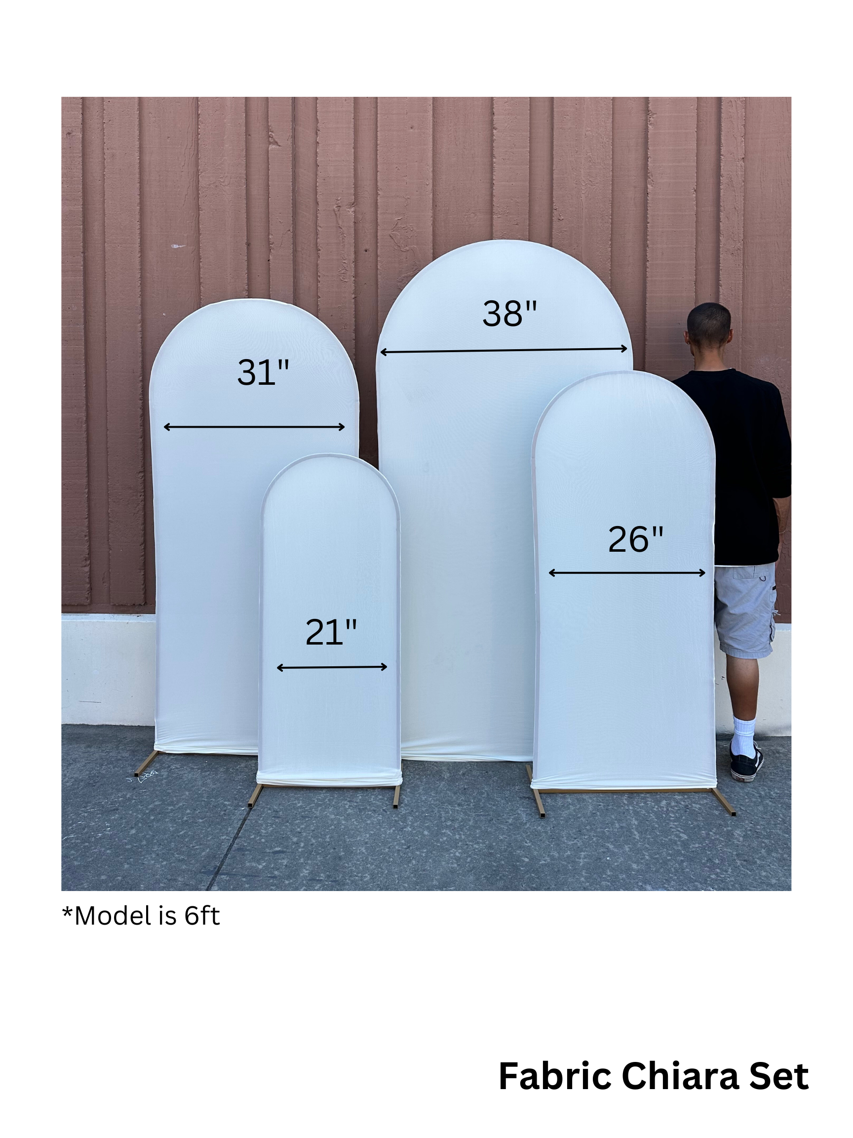 A set of fabric arch backdrops in various sizes; a person stands next to them.