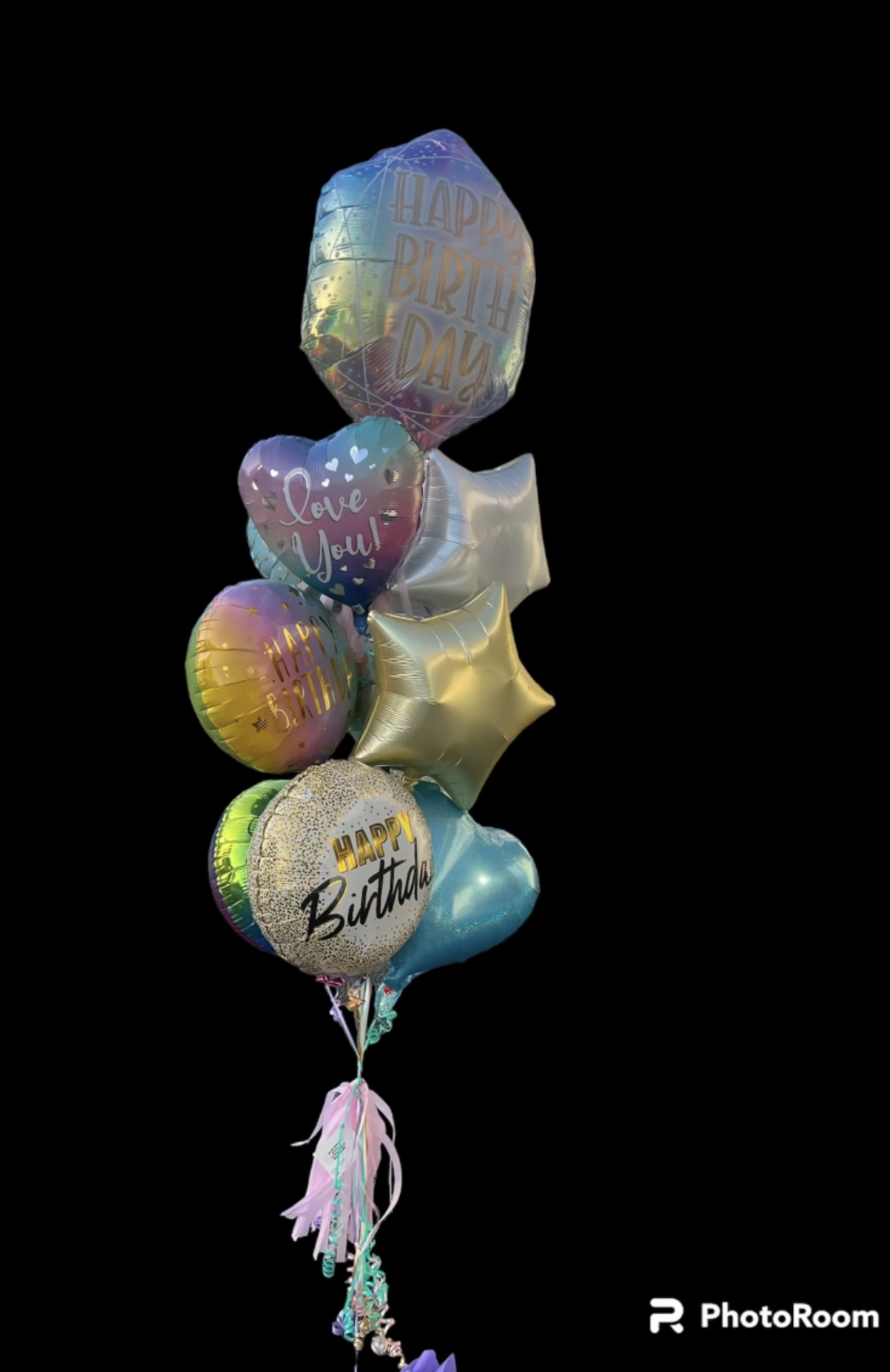 A colorful bouquet of birthday balloons.