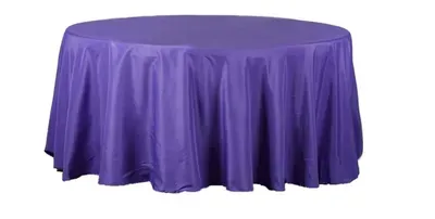 Purple round table with a flowing tablecloth.