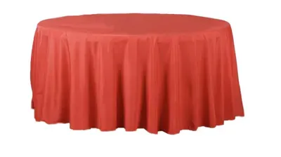 Red round table draped with a matching tablecloth.