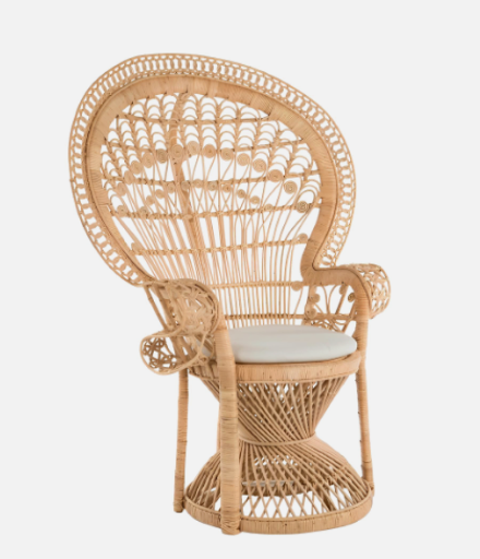 Rattan peacock chair with a high back and a circular seat cushion.