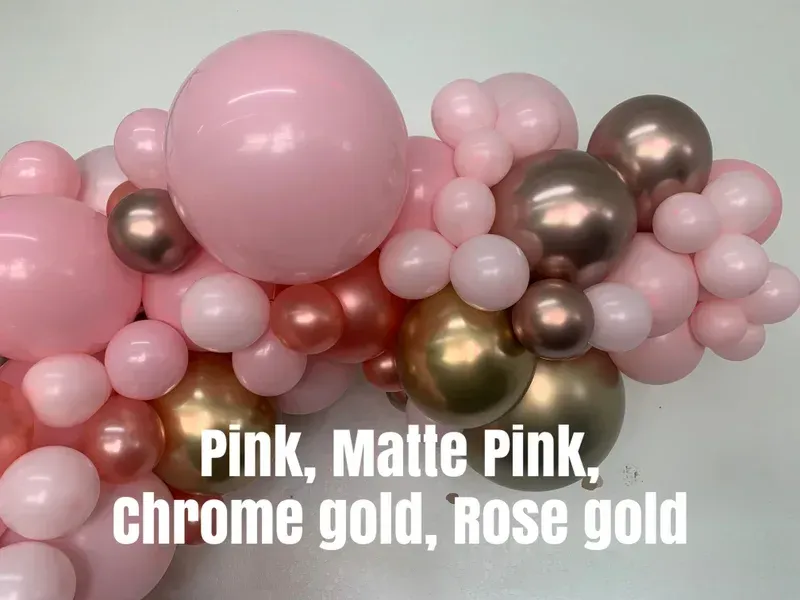 Balloon garland in shades of pink, rose gold, and chrome gold.