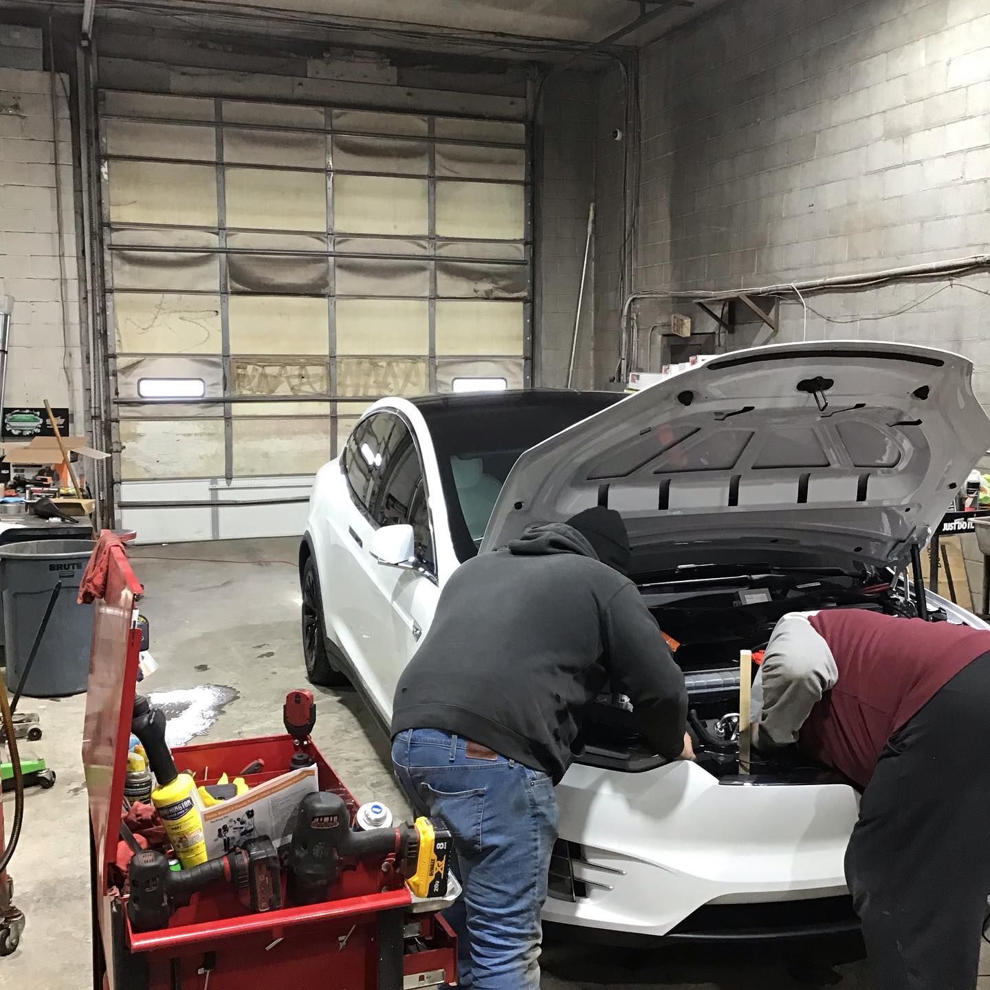 Technicians working on vehicle | JCruz Motors