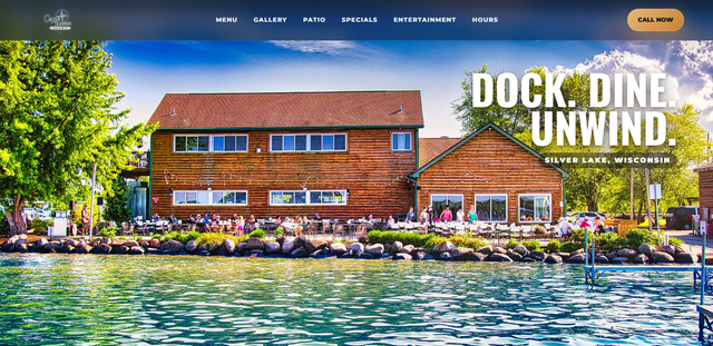 Copper Bottom Bar & Grill website with waterfront imagery and dining information.