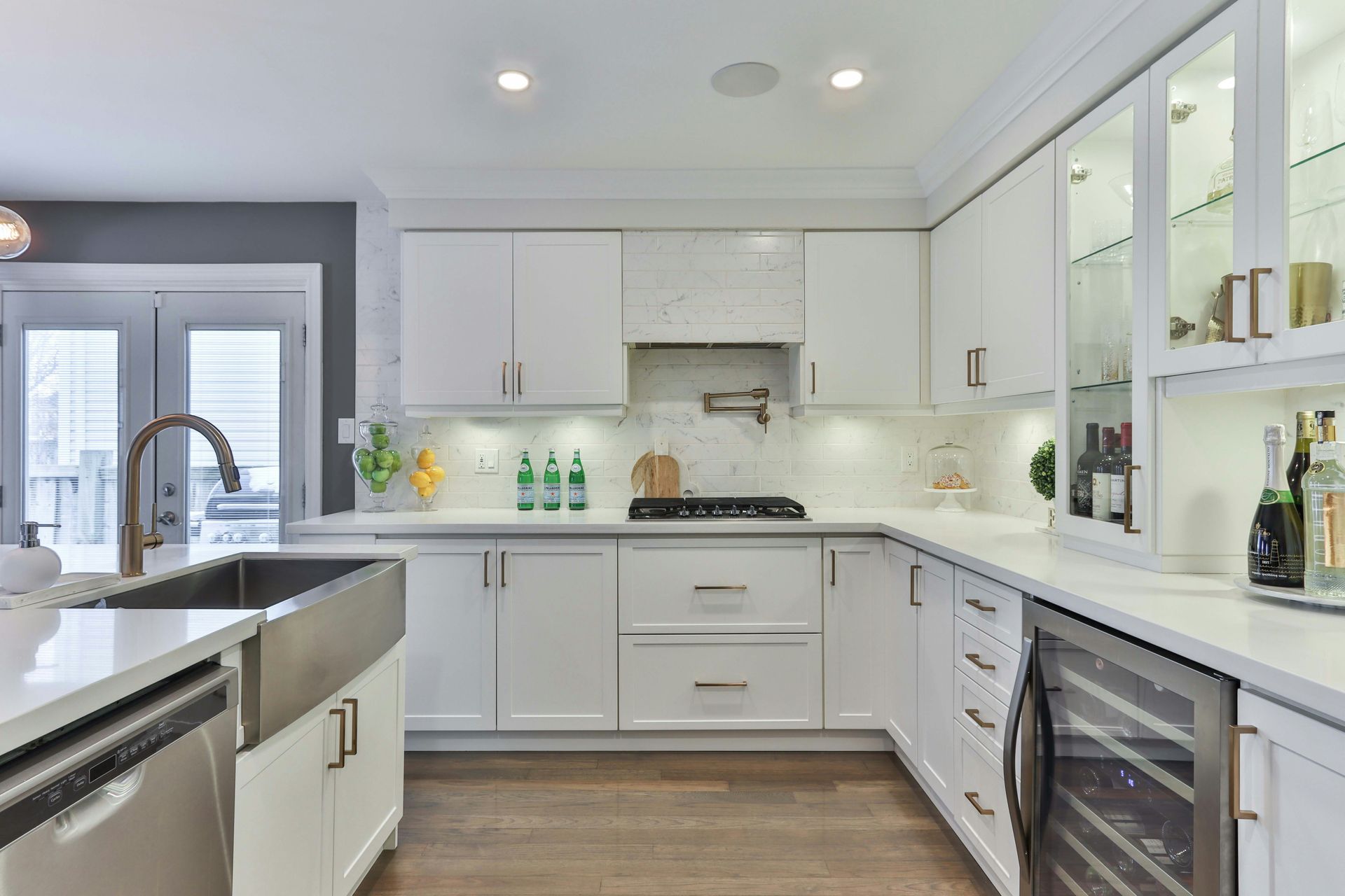 Bright kitchen with white cabinets, updated counters, and clean modern finishes after bathroom remodeling in Avondale, AZ