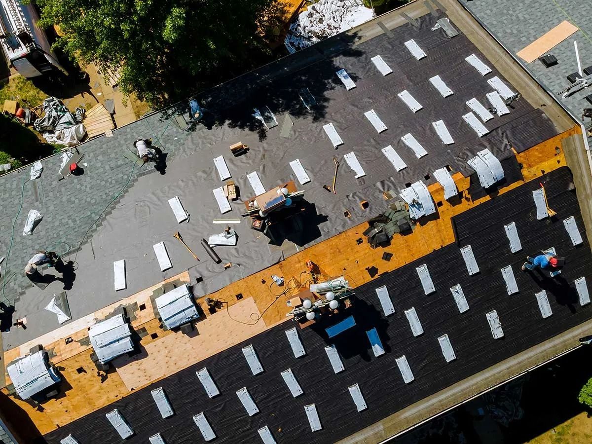 Aerial view of a crosswalk being installed on a city street with workers and equipment around it