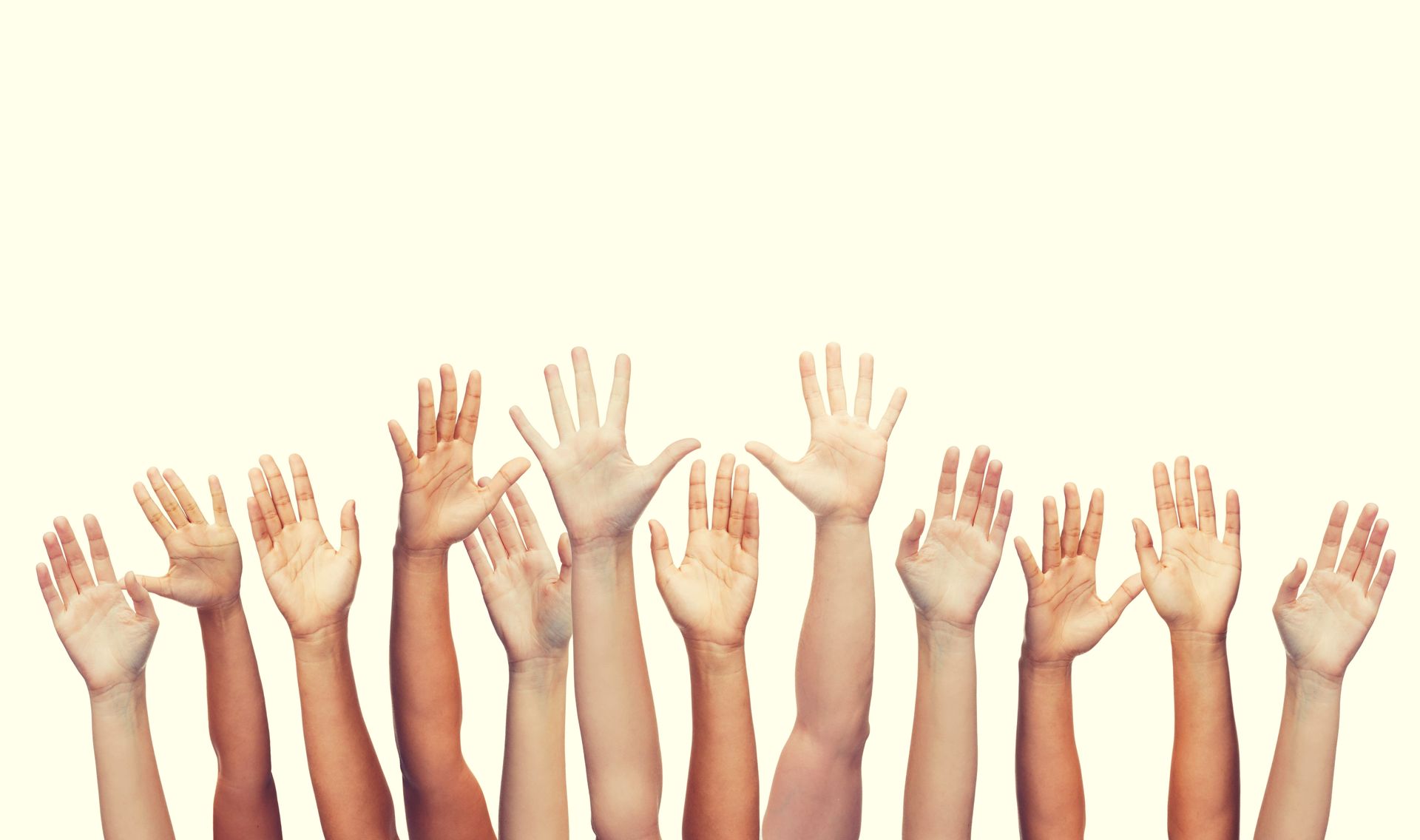 Raised hands reaching upward against a light background