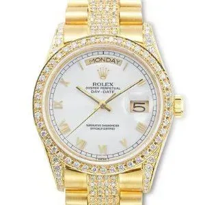 Gold Rolex Day-Date watch with diamond bezel and bracelet, white dial showing Monday and date 5
