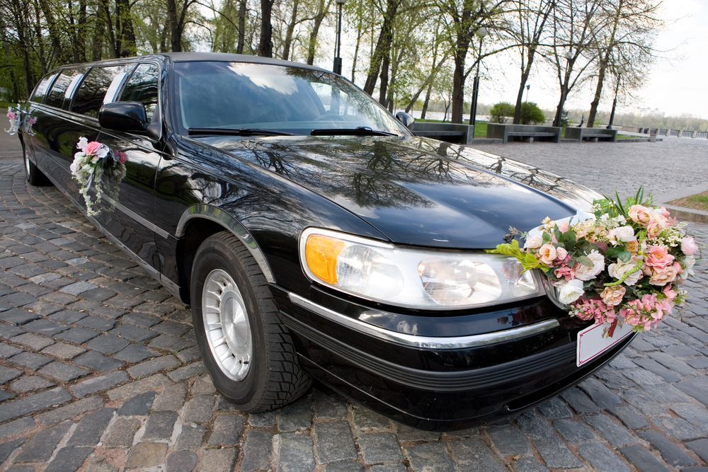 Black Limousine Decorated With Flowers — O'Brien Carglass & Tinting in Kuranda, QLD