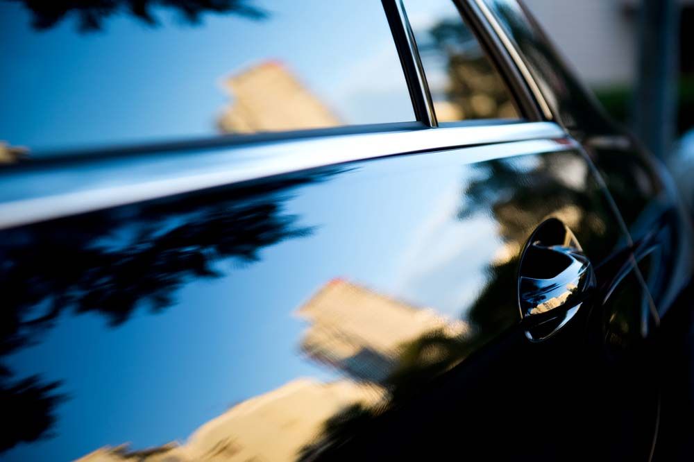 Sunset Reflecting on Car Paint and Tinted Windows — O'Brien Carglass & Tinting in Tolga, QLD