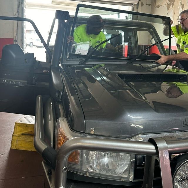 Applying Tinting Foil onto A Car Window — O'Brien Carglass & Tinting in Mareeba, QLD