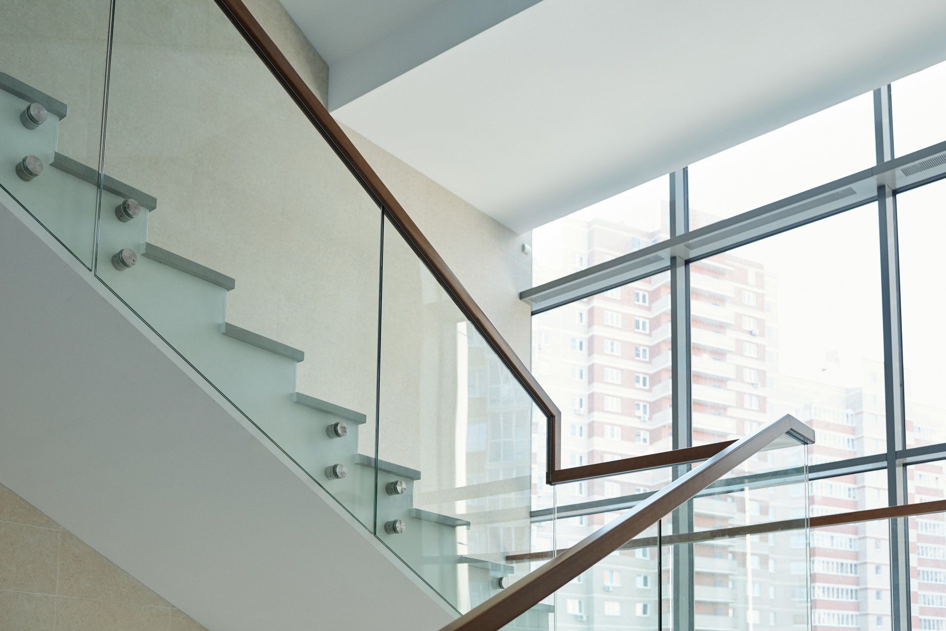 Glass railings showcase beautiful stairway.  