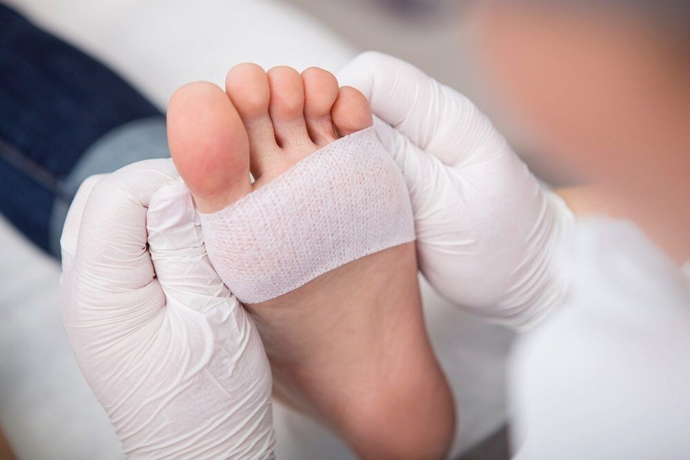 A Close Up Of A Person's Foot With A Bandage On It — Lake Macquarie Podiatry in Swansea, NSW