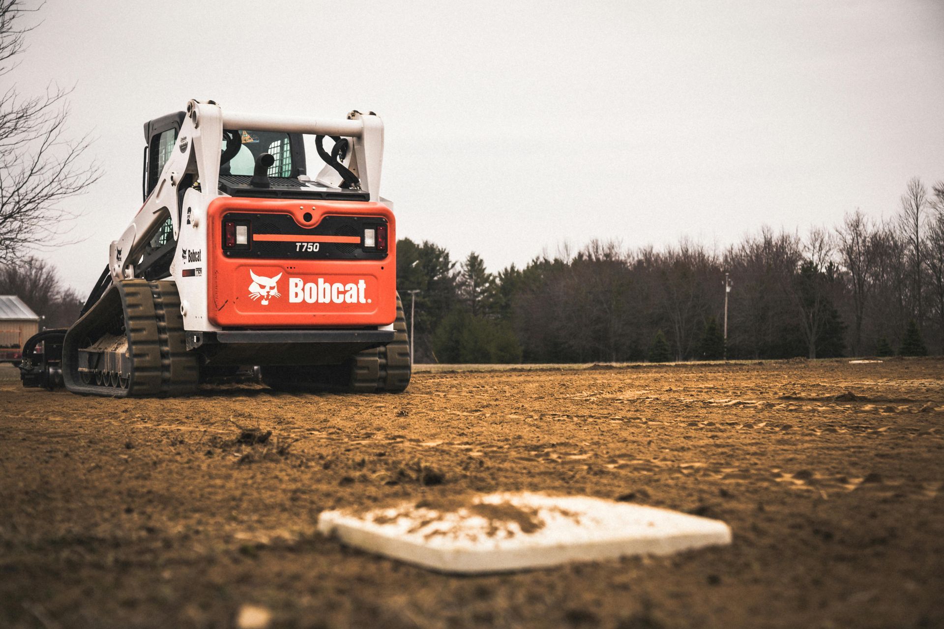 Universal skid steer attachments compatible with Bobcat, CAT, Kubota, John Deere, CASE and more.