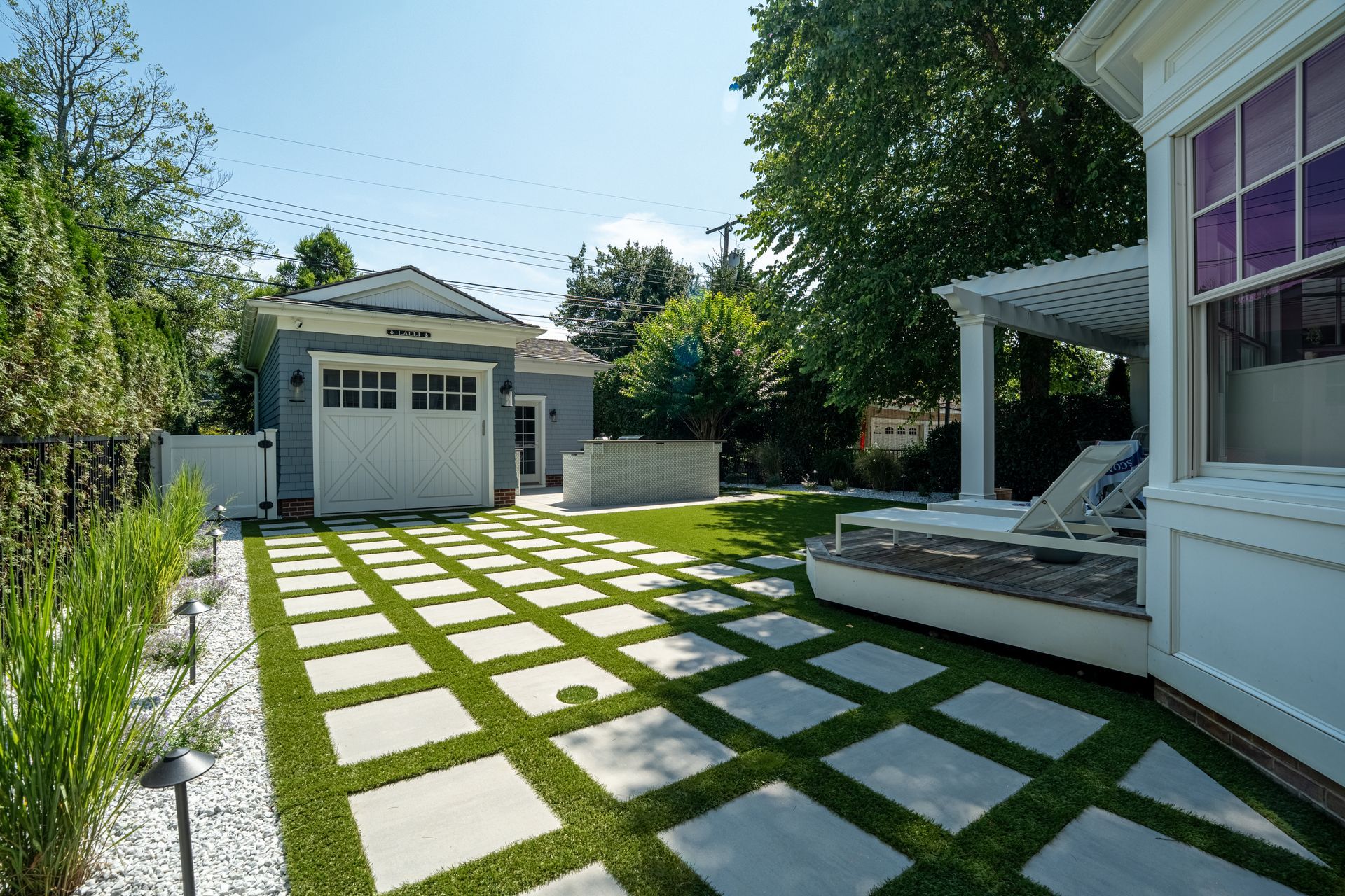 Circular paver patio with built-in fire pit and seating area