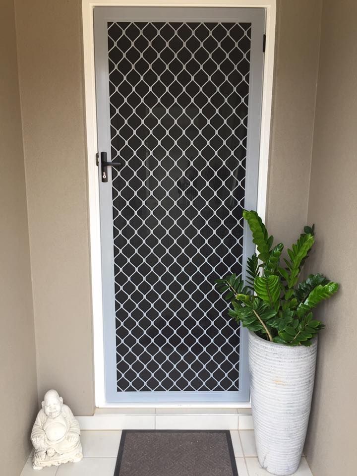 Maroon Front Door With Screen, White Trim, Beige Siding, and Brick Step — All Security Screens & Repairs In Bungalow, QLD