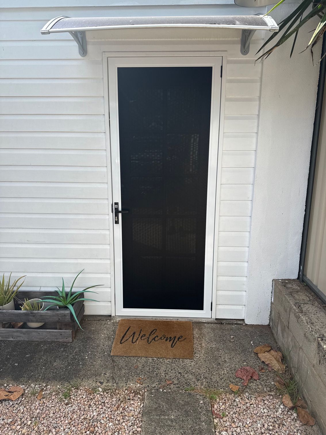 White door with screen, Welcome doormat — All Security Screens & Repairs In Bungalow, QLD