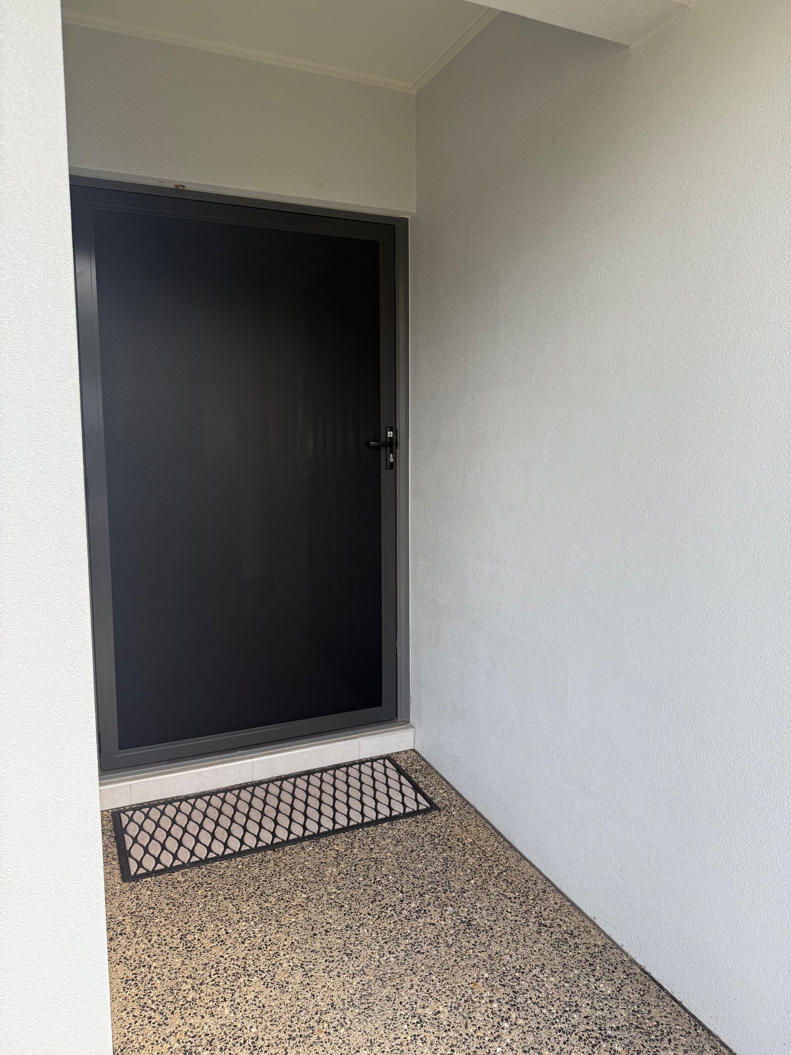 Black Security Door in a Recessed White Doorway — All Security Screens & Repairs In Bungalow, QLD