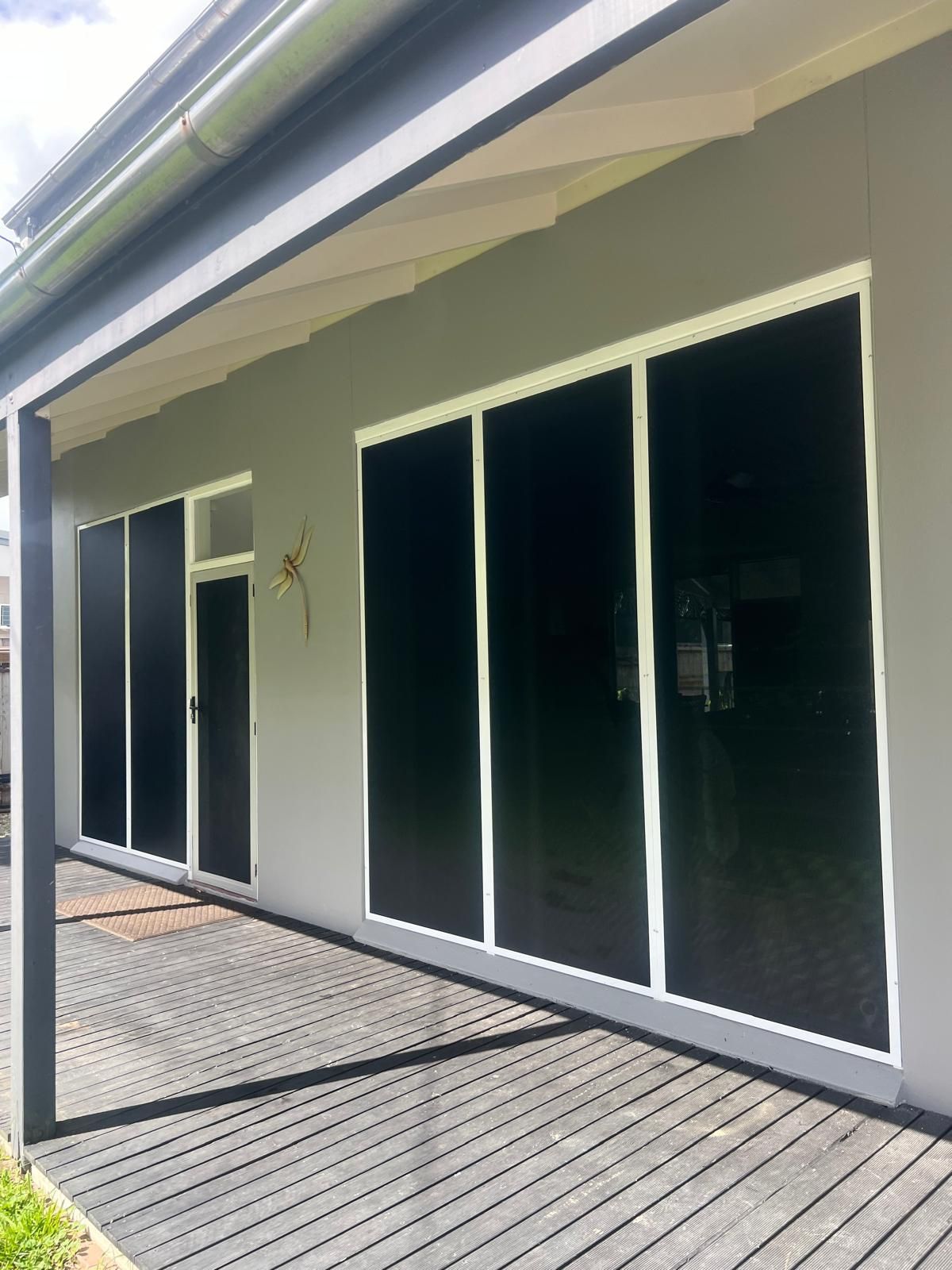 Entryway With White Door, Full-length Mirror and Light-coloured Walls — All Security Screens & Repairs In Bungalow, QLD