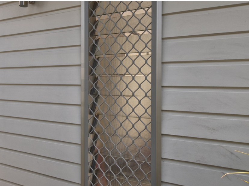 Yellow Machine Clamps to a Wooden Door Frame Next to a Screen Door — All Security Screens & Repairs In Bungalow, QLD