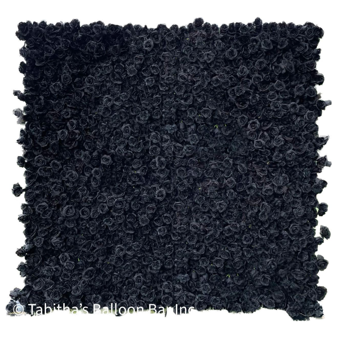 Square black fabric covered in small, textured, flower-like accents.