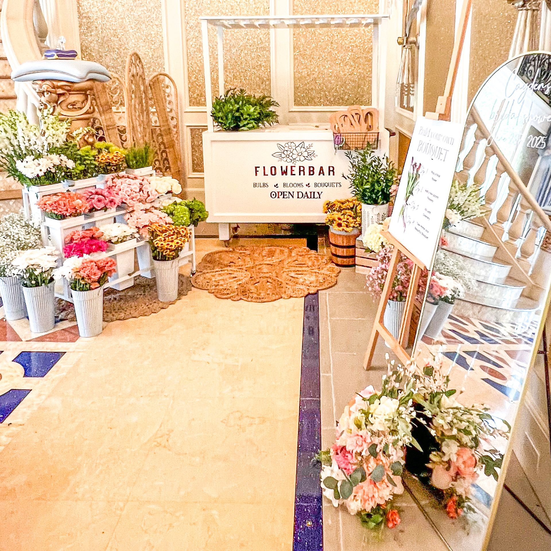 A room filled with flowers and a sign that says flowerbar