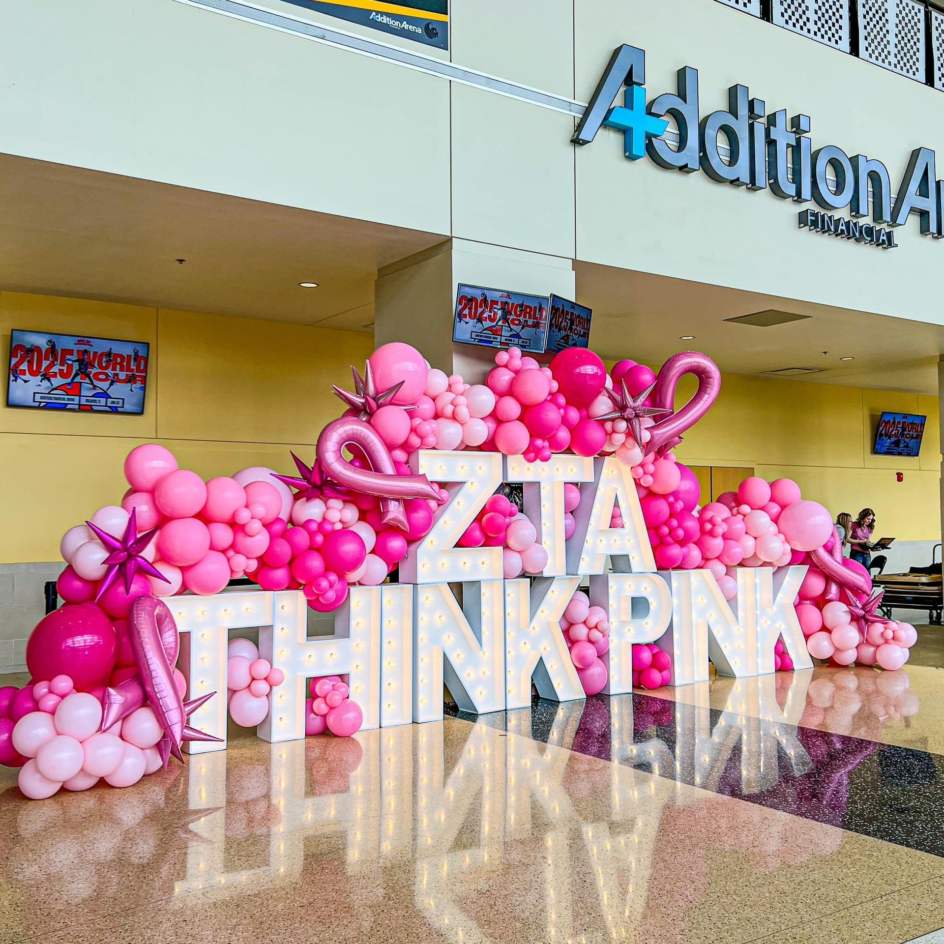 Pink balloons and letters spelling 