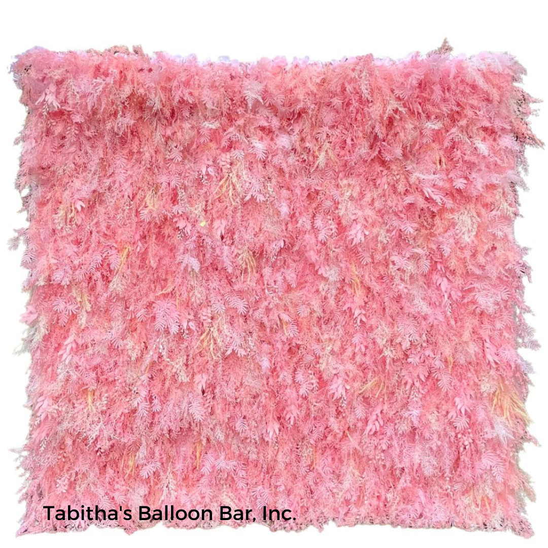 Pink, fluffy, textured wall backdrop with hints of yellow.