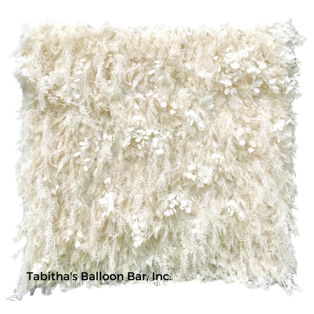 White fringed wall backdrop with small floral accents.