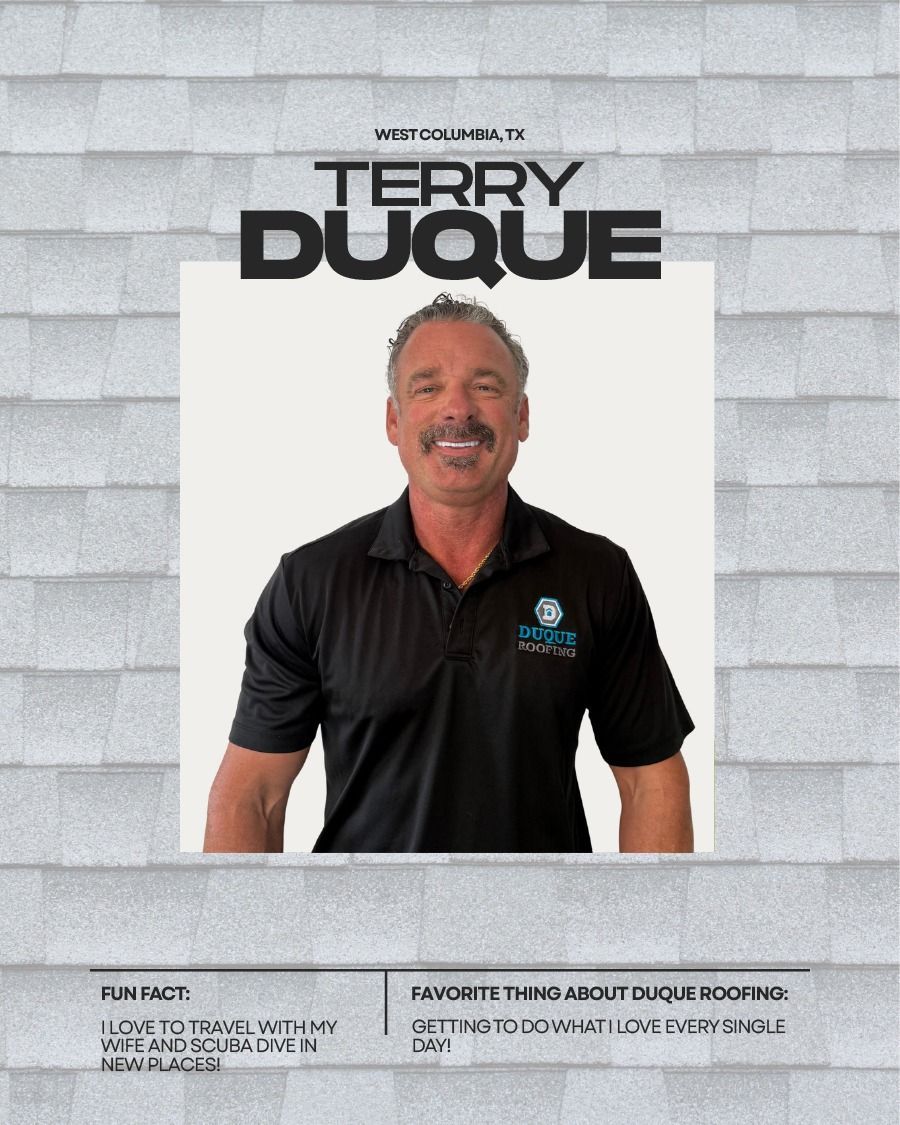 Terry Duque, smiling man in black polo shirt, standing in front of roofing material background.