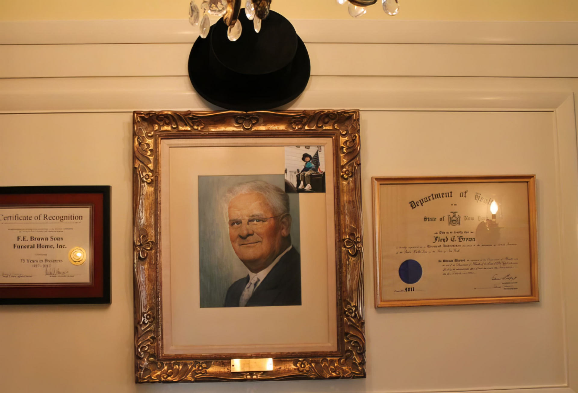 A framed picture of a man hanging on a wall