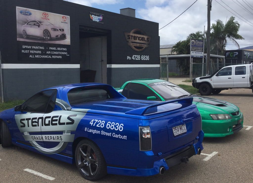 A Blue Car With the Word Stengels on the Side is Parked in Front of a Building — Stengels Crash Repairs In Garbutt, QLD