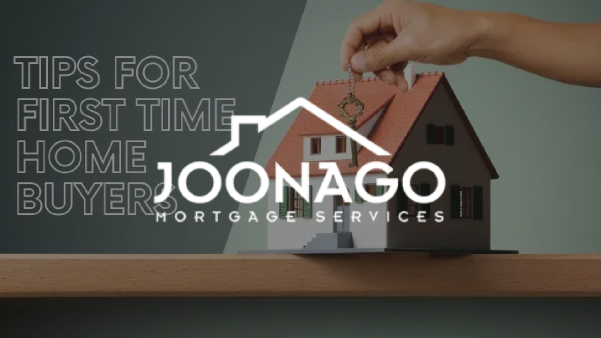 Hand placing a coin on a model house roof with 