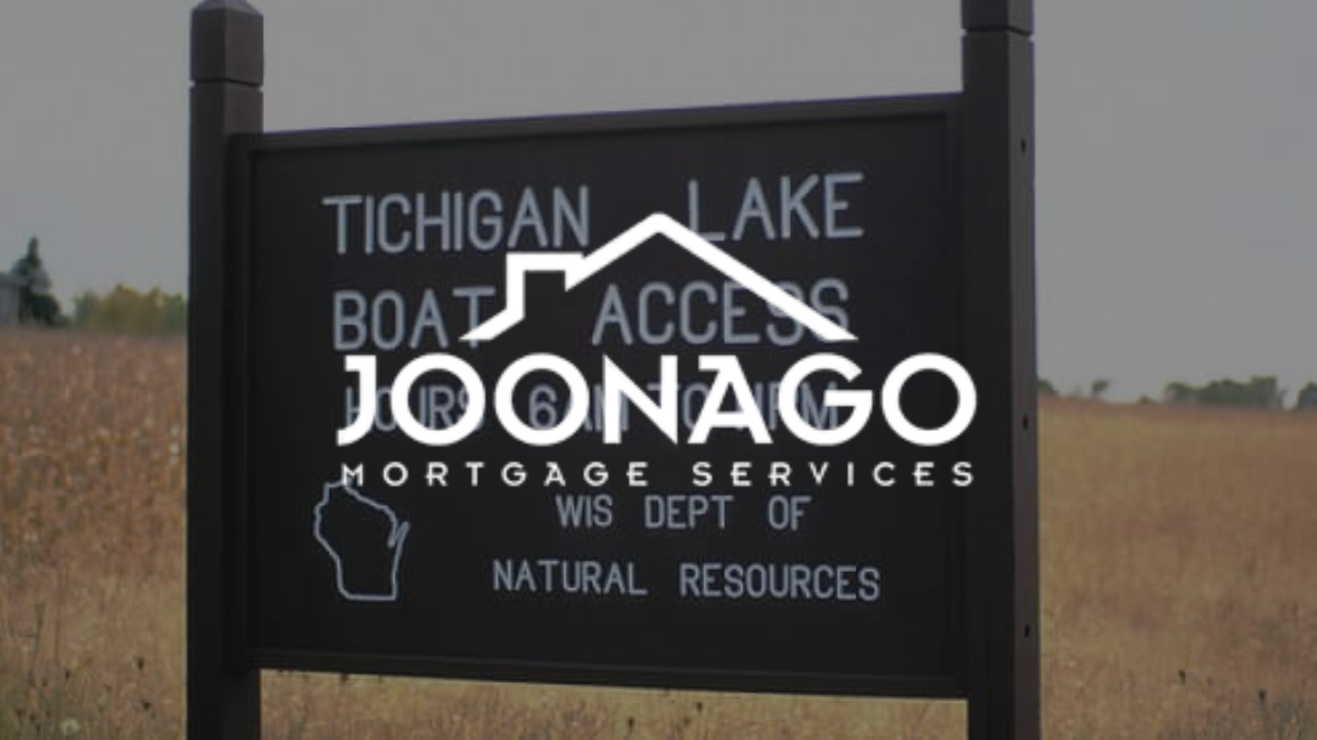 Sign for Tichigan Lake boat access, Wisconsin, with Joonago Mortgage Services logo overlaid.