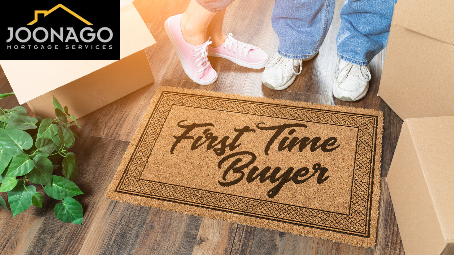 “First Time Buyer” doormat by a doorstep with two people standing nearby