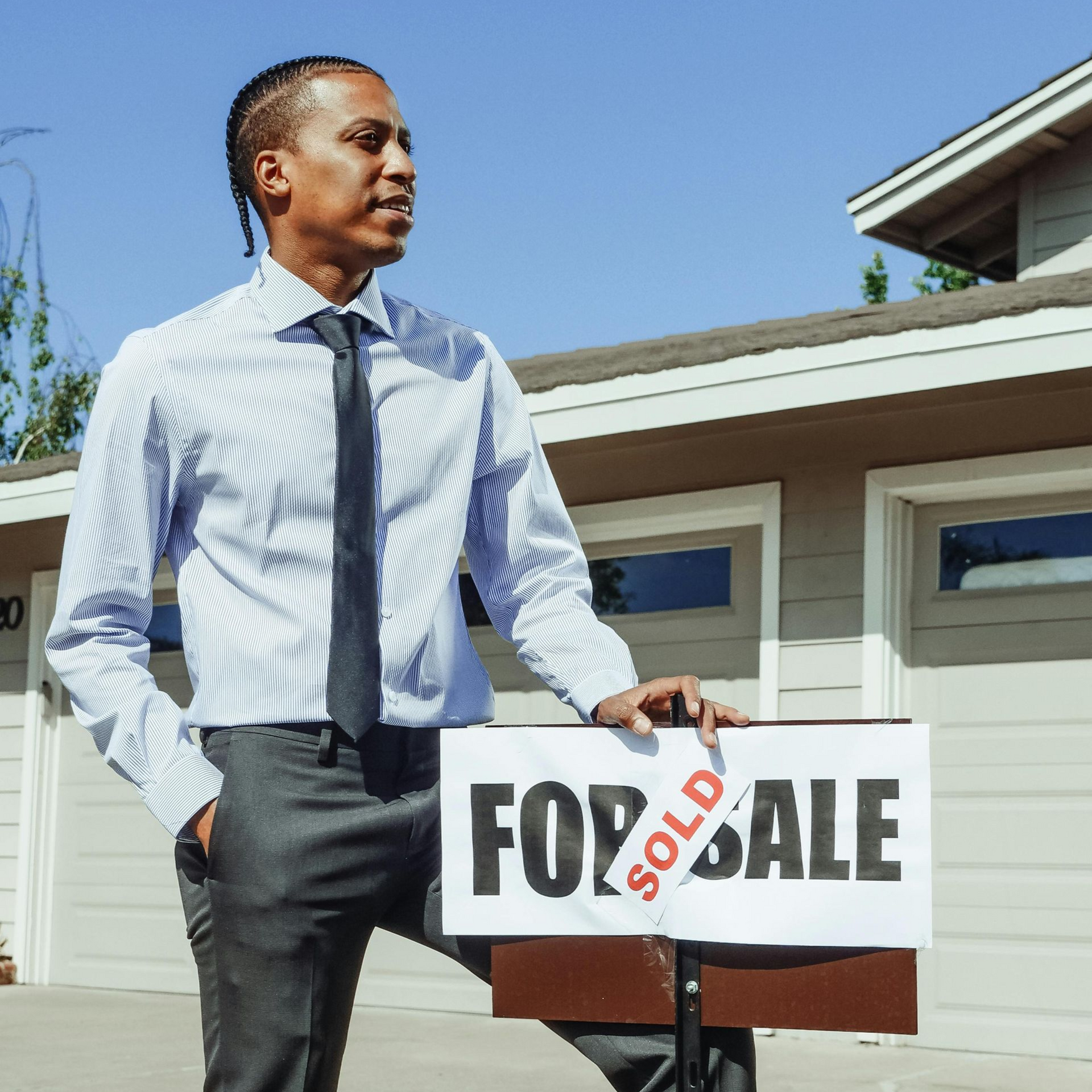 Man in business attire holding a