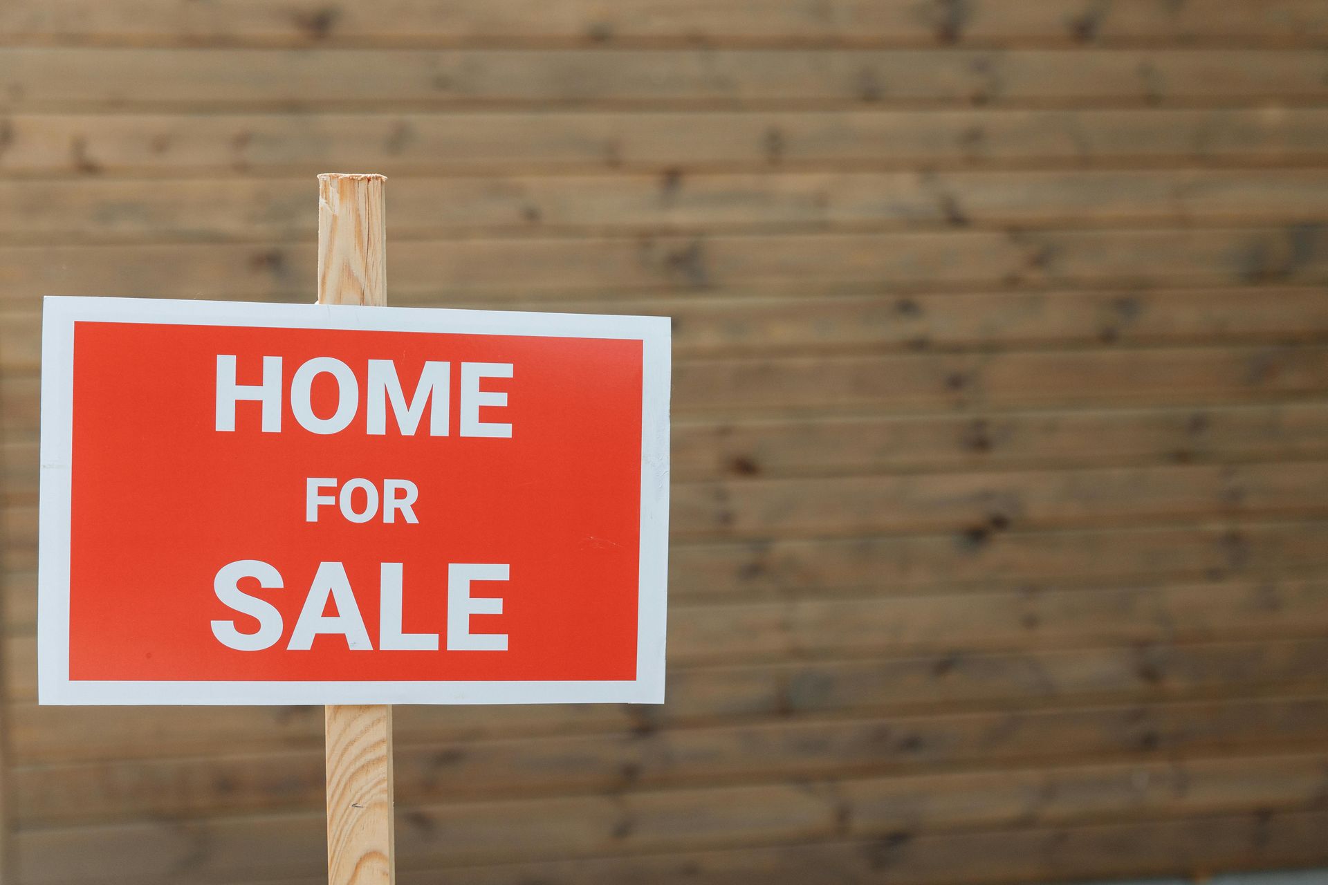 A red sign with white text reading 