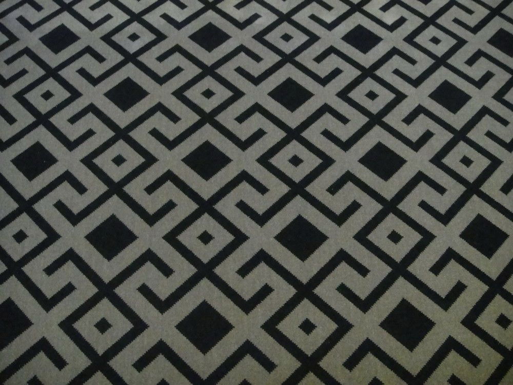 Gray and white geometric patterned fabric.