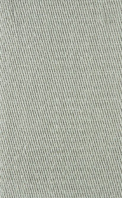 Close-up of light gray denim fabric with a diagonal twill weave.