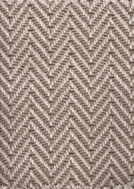 Herringbone pattern carpet in shades of gray and white.
