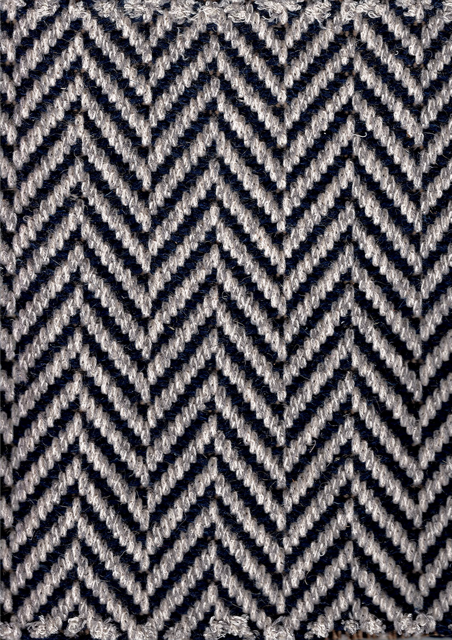 Chevron-patterned textile in navy and off-white.