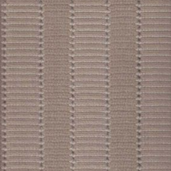 Close-up of a beige fabric with vertical rows of horizontal lines, giving a textured appearance.