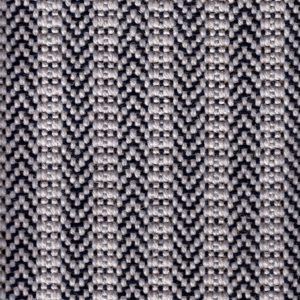 Close-up of a woven fabric with a black and white herringbone pattern.
