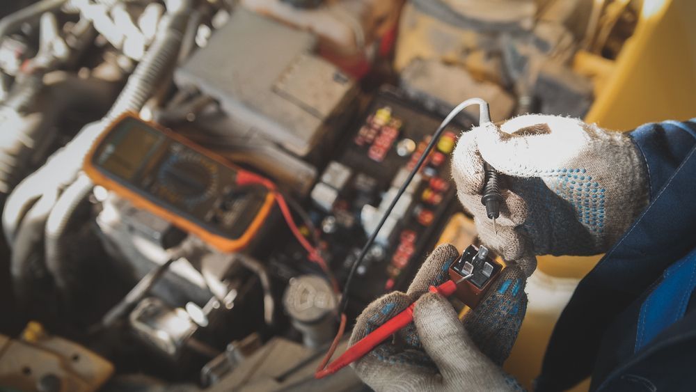 Mechanic Working on Car Electrics - Auto Electrical Service in Garbutt, QLD