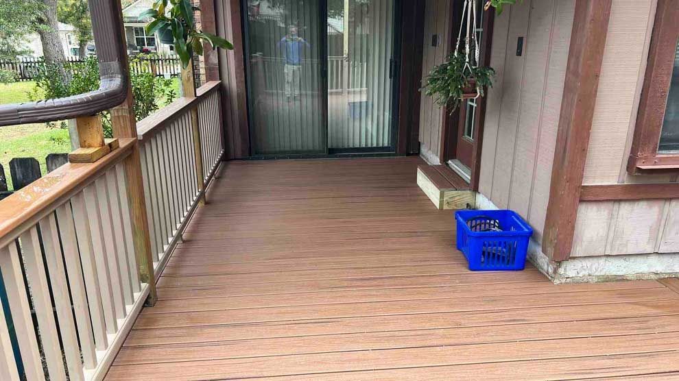 A wooden deck next to a house.